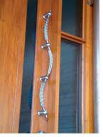 The stainless steel braided door pull creates a unique alternative, adding flair to house entrance designs.